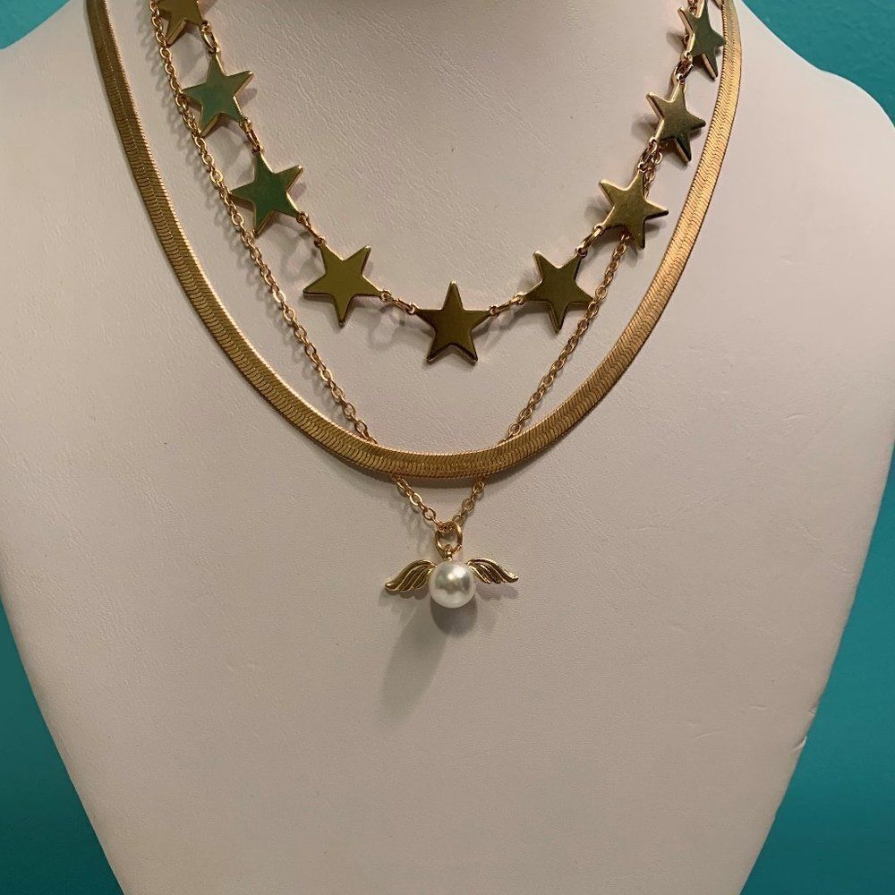 3 seperate gold coloured chains as bundle, pearl, stars, wide snake link